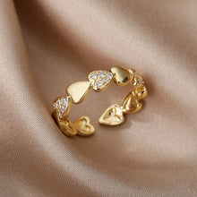 Anillo ajustable de acero inoxidable dorado con corazones y circonitas